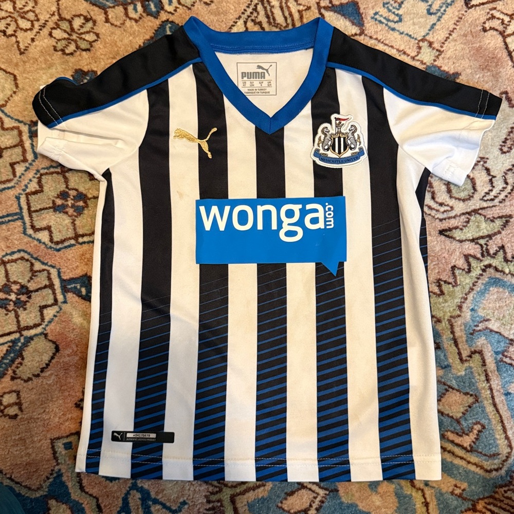 Newcastle United Puma Black and White Jersey with Blue Accents